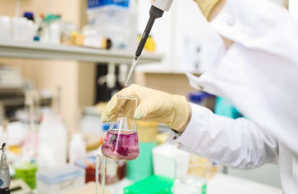 A technician testing dye in a laboratory setting