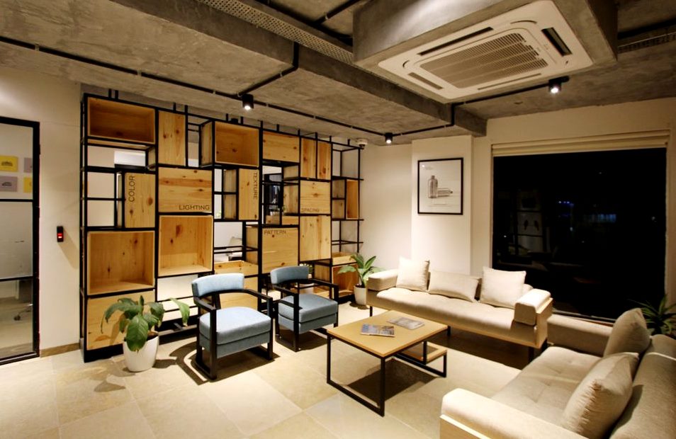 A furnished living room with large windows